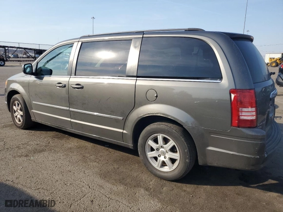 2010 Chrysler Town & Country Touring Plus with VIN 2A4RR8DX7AR454461, listed as a Copart auction lot 48957685 with 112,264 mi miles and Salvage Title. Bid and sale history available at carsss.com. Image 2.