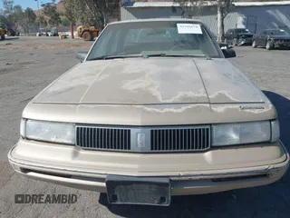 1993 Oldsmobile Cutlass Ciera S with VIN 1G3AG55N6P6421424, listed as a IAAI auction lot 41341670 with 221,301 mi miles and . Bid and sale history available at DreamBid. Image 6.
