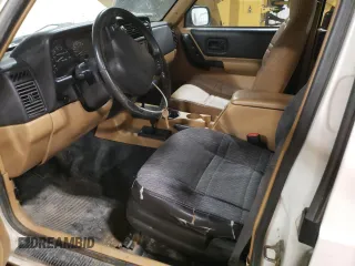 1998 Jeep Cherokee Sport with VIN 1J4FJ68S2WL239891, listed as a Copart auction lot 62966025 with 128,226 mi miles and Clean title. Bid and sale history available at DreamBid. Image 7.