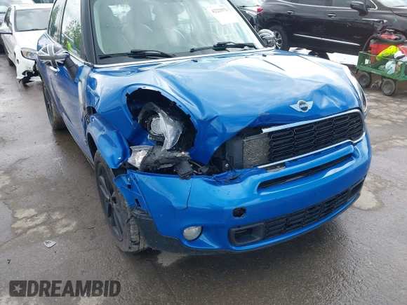 2014 MINI Countryman S with VIN WMWZC5C52EWP38659, listed as a IAAI auction lot 42229976 with 115,229 mi miles and . Bid and sale history available at DreamBid. Image 6.