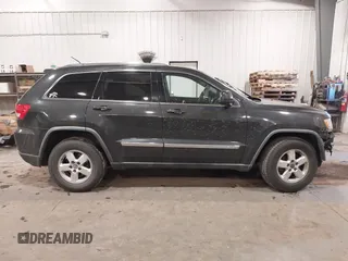 2011 Jeep Grand Cherokee 70th Anniversary with VIN 1J4RR4GG3BC745652, listed as a IAAI auction lot 41133698 with 217,948 mi miles. Bid and sale history available at carsss.com. Image 13.