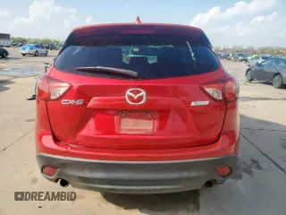 2014 Mazda CX-5 Touring with VIN JM3KE2CY1E0323298, listed as a Copart auction lot 50421685 with 214,739 mi miles and Salvage Title. Bid and sale history available at DreamBid. Image 6.