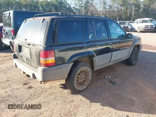 1998 Jeep Grand Cherokee Laredo with VIN 1J4FX58S7WC283734, listed as a IAAI auction lot 41267813 with 266,189 mi miles. Bid and sale history available at carsss.com. Image 4.