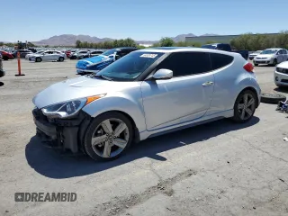 2014 Hyundai Veloster Turbo с VIN KMHTC6AE7EU204341, выставлен на аукционе Copart как лот 64009745 с пробегом 76 088 миль миль и Списание • Salvage title. История ставок и продаж доступна на DreamBid. Изображение 1.