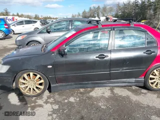 2003 Mitsubishi Lancer OZ-Rally with VIN JA3AJ86E03U078826, listed as a IAAI auction lot 41700333 with 119,656 mi miles. Bid and sale history available at carsss.com. Image 6.