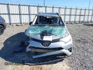 2018 Toyota RAV4 XLE with VIN 2T3RFREVXJW748993, listed as a IAAI auction lot 41878888 with 111,760 mi miles and . Bid and sale history available at DreamBid. Image 12.
