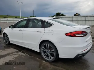 2020 Ford Fusion Titanium with VIN 3FA6P0D96LR175863, listed as a Copart auction lot 60570305 with 76,064 mi miles and Salvage title. Bid and sale history available at DreamBid. Image 2.