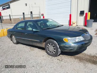 2000 Lincoln Continental with VIN 1LNHM97VXYY759969, listed as a IAAI auction lot 41892082 with 114,389 mi miles. Bid and sale history available at carsss.com. Image 1.