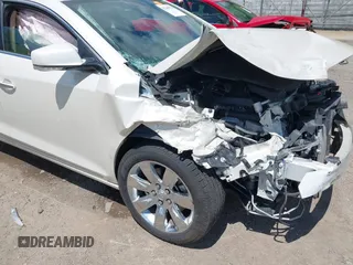 2012 Buick LaCrosse Premium 1 z VIN 1G4GD5E34CF130301, wystawiony jako IAAI lot #42205574 z przebiegiem 117 941 mil mil oraz . Historia ofert i sprzedaży dostępna na DreamBid. Obrazek 18.