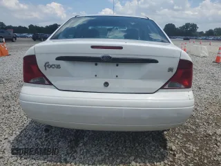 2003 Ford Focus SE with VIN 1FAFP34353W231334, listed as a Copart auction lot 63844205 with 86,601 mi miles and Salvage title. Bid and sale history available at DreamBid. Image 6.
