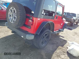 2004 Jeep Wrangler Sport Right Hand Drive with VIN 1J4F449S74P796957, listed as a IAAI auction lot 41987562 with 106,730 mi miles and . Bid and sale history available at carsss.com. Image 4.
