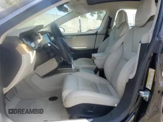 2019 Tesla Model S 100D with VIN 5YJSA1E42KF331240, listed as a Copart auction lot 54713975 with 43,940 mi miles and Salvage title. Bid and sale history available at DreamBid. Image 7.