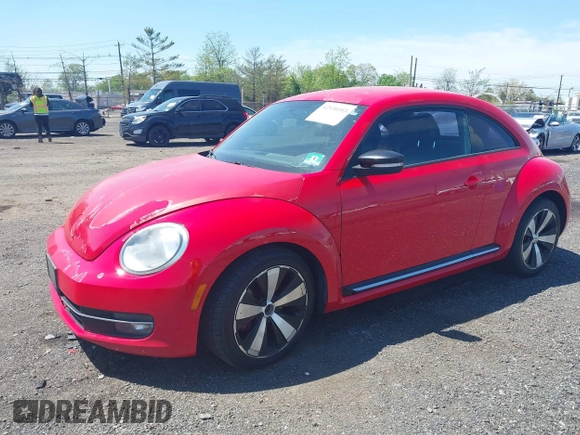 2012 Volkswagen Beetle 2.0T Turbo w/Sun/Snd/Nav PZEV with VIN 3VWVA7AT4CM608798, listed as a IAAI auction lot 42130353 with 152,052 mi miles. Bid and sale history available at carsss.com. Image 2.