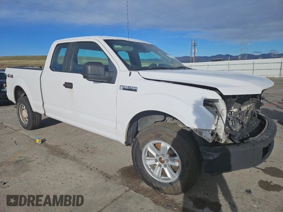 2015 Ford F-150 XLT with VIN 1FTFX1EFXFKD70393, listed as a Copart auction lot 51320365 with 173,741 mi miles and Salvage title. Bid and sale history available at DreamBid. Image 4.