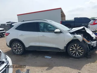 2020 Ford Escape Titanium Hybrid with VIN 1FMCU0DZ9LUA54867, listed as a IAAI auction lot 42268245 with 68,974 mi miles and . Bid and sale history available at DreamBid. Image 13.