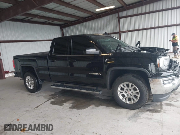 2017 GMC Sierra 1500 SLE z VIN 1GTV2MEC2HZ324763, wystawiony jako IAAI lot #42234082 z przebiegiem 106 984 mil mil oraz . Historia ofert i sprzedaży dostępna na DreamBid. Obrazek 13.
