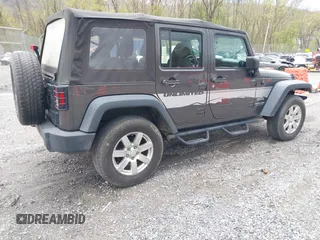 2018 Jeep Wrangler JK Unlimited Sport S with VIN 1C4BJWDG8JL895981, listed as a IAAI auction lot 42048316 with 95,457 mi miles. Bid and sale history available at carsss.com. Image 4.