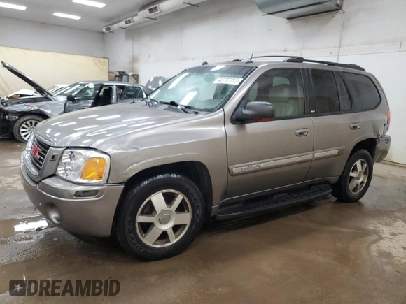 2005 GMC Envoy SLE with VIN 1GKDS13S952383743, listed as a Copart auction lot 43797315 with 185,833 mi miles and Salvage title. Bid and sale history available at DreamBid. Image 1.