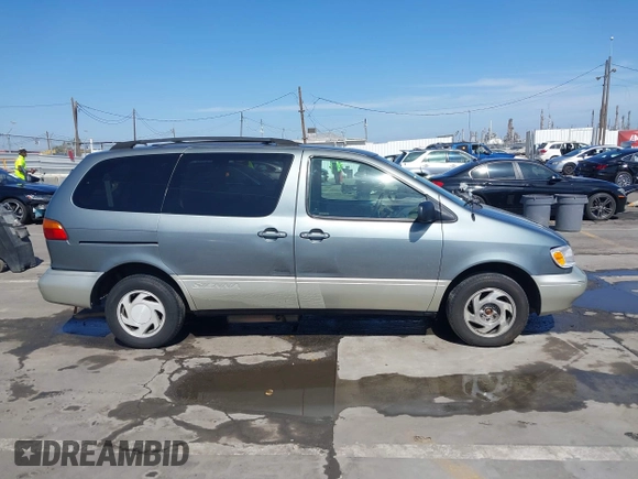 1999 Toyota Sienna LE with VIN 4T3ZF13C5XU099020, listed as a IAAI auction lot 41709287 with 206,884 mi miles. Bid and sale history available at carsss.com. Image 13.