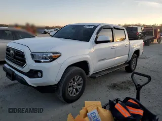 2018 Toyota Tacoma SR5 with VIN 3TMAZ5CN8JM077096, listed as a Copart auction lot 82294614 with 120,996 mi miles and Salvage Title. Bid and sale history available at DreamBid. Image 1.