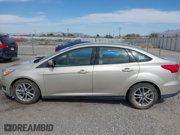 2018 Ford Focus SE with VIN 1FADP3FE7JL230870, listed as a IAAI auction lot 42021541 with 84,000 mi miles. Bid and sale history available at carsss.com. Image 14.