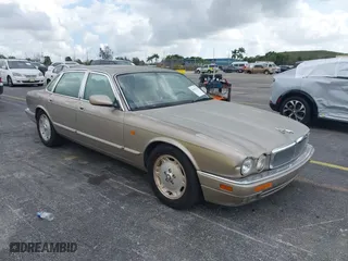 1997 Jaguar XJ with VIN SAJHX1243VC811786, listed as a IAAI auction lot 41451521 with 1 mi miles. Bid and sale history available at carsss.com. Image 1.