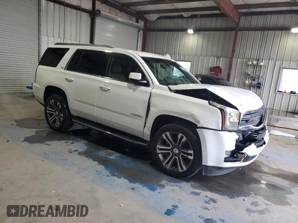 2016 GMC Yukon SLT with VIN 1GKS1BKC5GR450147, listed as a Copart auction lot 51058805 with 163,944 mi miles and Salvage Title. Bid and sale history available at carsss.com. Image 4.