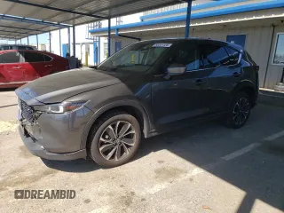 2022 Mazda CX-5 2.5 S Premium Package with VIN JM3KFBDM5N0602570, listed as a Copart auction lot 50441125 with 25,199 mi miles and Salvage Title. Bid and sale history available at carsss.com. Image 1.