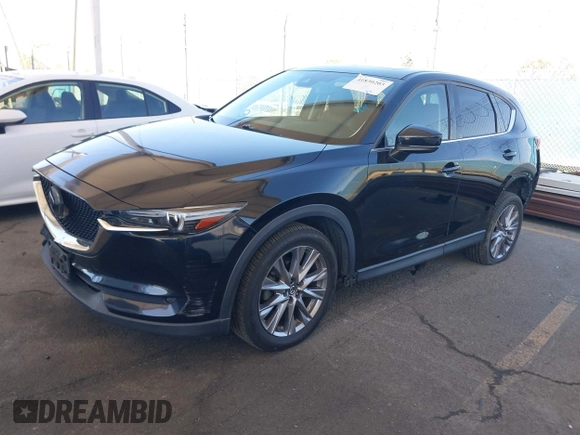 2020 Mazda CX-5 Grand Touring z VIN JM3KFADMXL0740144, wystawiony jako IAAI lot #41830203 z przebiegiem 70 535 mil mil oraz . Historia ofert i sprzedaży dostępna na DreamBid. Obrazek 17.