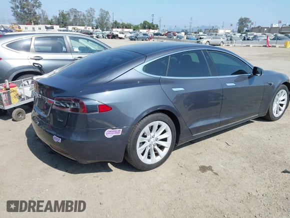2019 Tesla Model S 75D with VIN 5YJSA1E25KF304371, listed as a IAAI auction lot 42349856 with 64,788 mi miles and . Bid and sale history available at DreamBid. Image 4.