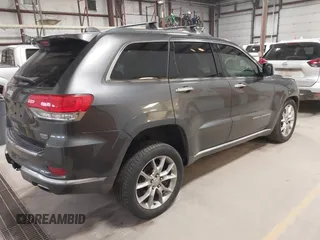 2015 Jeep Grand Cherokee Summit with VIN 1C4RJFJT6FC754799, listed as a IAAI auction lot 41699124 with 124,206 mi miles and . Bid and sale history available at DreamBid. Image 4.