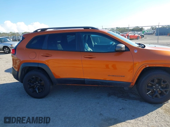 2014 Jeep Cherokee Trailhawk with VIN 1C4PJMBS4EW254879, listed as a IAAI auction lot 41550356 with 101,077 mi miles. Bid and sale history available at carsss.com. Image 14.