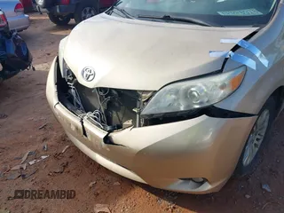 2011 Toyota Sienna XLE AAS with VIN 5TDYK3DCXBS117023, listed as a IAAI auction lot 41581785 with 216,341 mi miles. Bid and sale history available at carsss.com. Image 6.