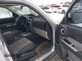 2007 Dodge Nitro SLT with VIN 1D8GU58K07W734541, listed as a IAAI auction lot 41556413 with 221,119 mi miles. Bid and sale history available at carsss.com. Image 5.