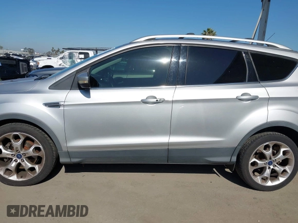2015 Ford Escape Titanium with VIN 1FMCU0J90FUA43720, listed as a IAAI auction lot 42541048 with 98,948 mi miles and . Bid and sale history available at DreamBid. Image 14.