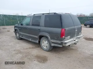 1999 GMC Yukon with VIN 1GKEK13R0XJ803237, listed as a IAAI auction lot 41736117 with 295,793 mi miles. Bid and sale history available at carsss.com. Image 3.