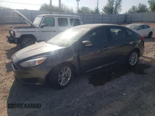 2017 Ford Focus SE z VIN 1FADP3F25HL300107, wystawiony jako Copart lot #52948965 z przebiegiem 94 977 mil mil oraz Szkoda całkowita • Salvage title. Historia ofert i sprzedaży dostępna na DreamBid. Obrazek 1.