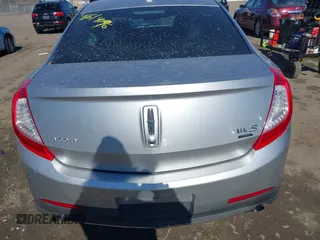 2013 Lincoln MKS EcoBoost with VIN 1LNHL9FT9DG613100, listed as a IAAI auction lot 41614096 with 207,789 mi miles. Bid and sale history available at carsss.com. Image 16.
