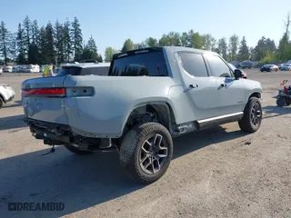 2022 Rivian R1T Adventure Package with VIN 7FCTGAAA5NN007018, listed as a IAAI auction lot 42018939 with 41,991 mi miles. Bid and sale history available at carsss.com. Image 4.