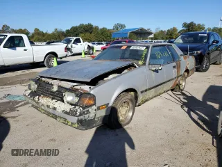 1984 Toyota Celica z VIN JT2RA64C7E6218560, wystawiony jako Copart lot #63087872 z przebiegiem 168 288 mil mil oraz Czysty tytuł • Clean title. Historia ofert i sprzedaży dostępna na DreamBid. Obrazek 2.
