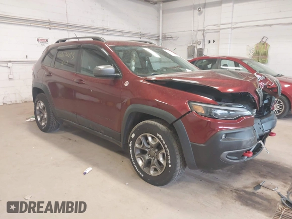 2019 Jeep Cherokee Trailhawk z VIN 1C4PJMBX0KD361981, wystawiony jako IAAI lot #42074093 z przebiegiem 56 989 mil mil oraz . Historia ofert i sprzedaży dostępna na DreamBid. Obrazek 1.
