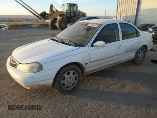 1999 Mercury Mystique GS z VIN 1MEFM6532XK638087, wystawiony jako Copart lot #85269414 z przebiegiem 192 506 mil mil oraz Szkody całkowita. Historia ofert i sprzedaży dostępna na DreamBid. Obrazek 1.