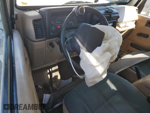 2000 Jeep Wrangler Sahara with VIN 1J4FA59SXYP764539, listed as a Copart auction lot 52707385 with 136,159 mi miles and Salvage title. Bid and sale history available at DreamBid. Image 8.