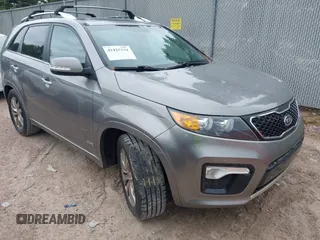 2012 Kia Sorento SX z VIN 5XYKWDA22CG274457, wystawiony jako IAAI lot #42425334 z przebiegiem 167 664 mil mil oraz . Historia ofert i sprzedaży dostępna na DreamBid. Obrazek 1.
