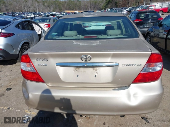 2002 Toyota Camry LE z VIN 4T1BE32K02U051709, wystawiony jako IAAI lot #41485620 z przebiegiem 232 876 mil mil oraz . Historia ofert i sprzedaży dostępna na DreamBid. Obrazek 16.