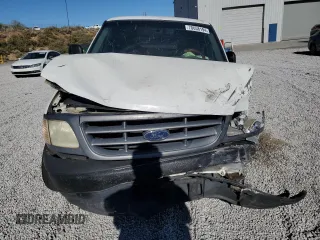2000 Ford F-150 XL with VIN 2FTPF17Z5YCA99717, listed as a Copart auction lot 70658194 with Not provided miles and Salvage title. Bid and sale history available at DreamBid. Image 5.