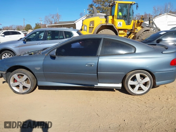 2005 Pontiac GTO z VIN 6G2VX12U45L454630, wystawiony jako IAAI lot #41052119 z przebiegiem Nie podano mil oraz . Historia ofert i sprzedaży dostępna na DreamBid. Obrazek 15.