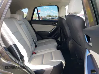 2016 Mazda CX-5 Grand Touring with VIN JM3KE2DYXG0773663, listed as a IAAI auction lot 41896367 with 86,571 mi miles and . Bid and sale history available at DreamBid. Image 8.