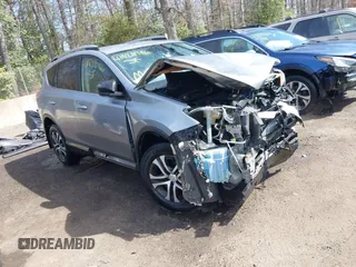 2018 Toyota RAV4 LE with VIN JTMBFREV3JJ216131, listed as a IAAI auction lot 41828786 with 121,601 mi miles. Bid and sale history available at carsss.com. Image 1.