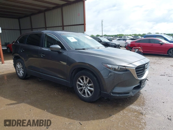 2016 Mazda CX-9 Sport with VIN JM3TCABY5G0122478, listed as a IAAI auction lot 42115795 with 134,980 mi miles and . Bid and sale history available at DreamBid. Image 1.